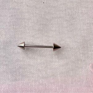 Silver Arrow Barbell piercing